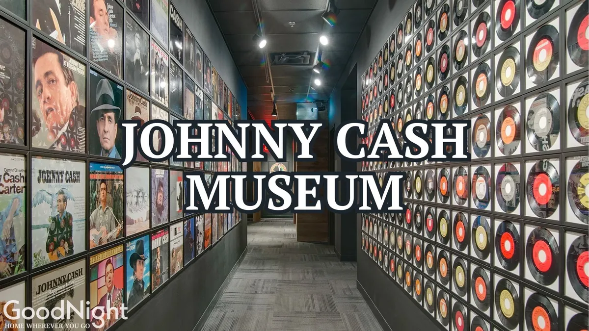 A close-up of the Johnny Cash Museum's entrance display, featuring iconic album covers, vinyl records, and clear museum signage. The ambiance suggests a reflective, immersive experience into music history.